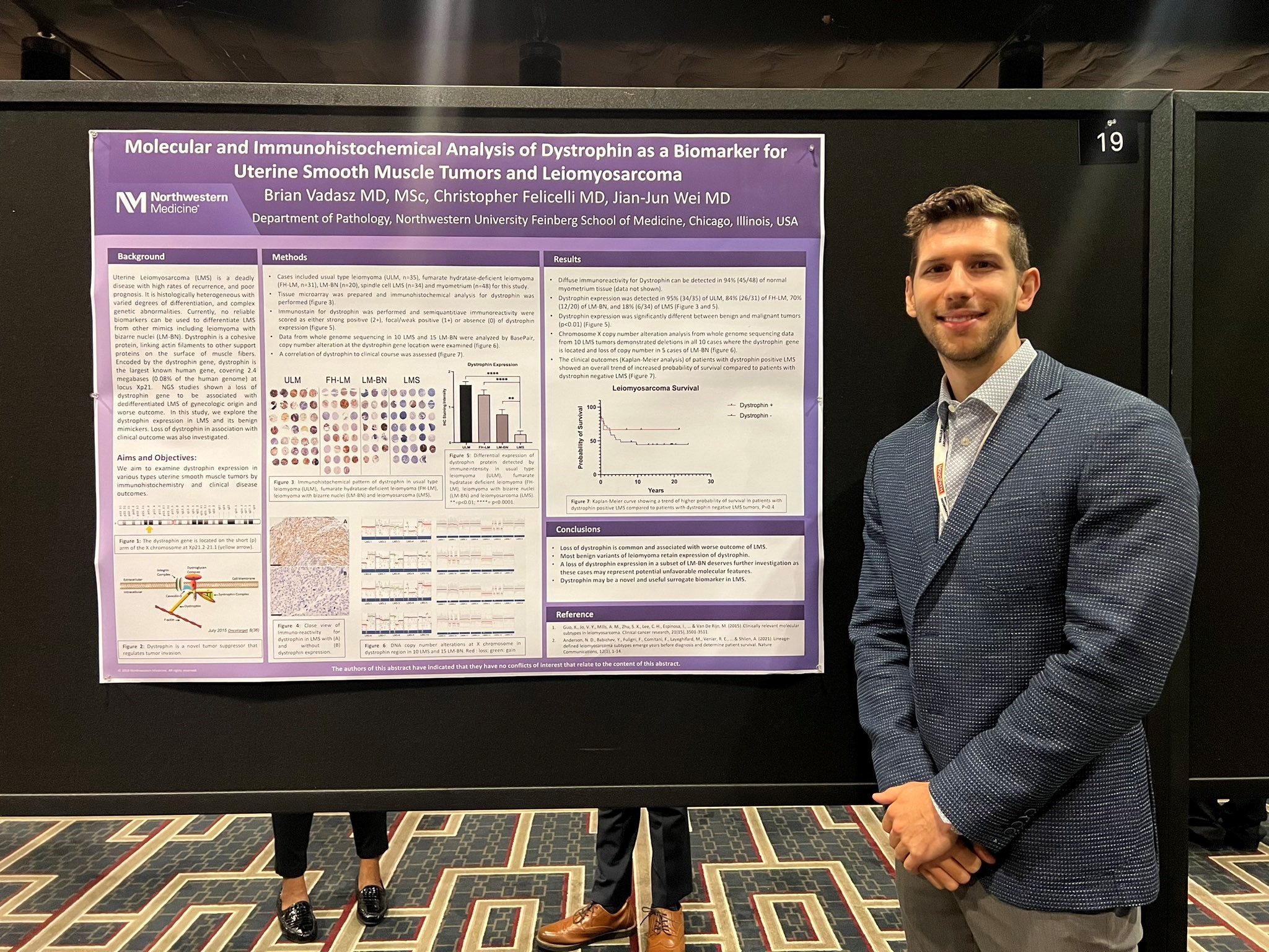 Brian Vadasz in front of his winning CAP poster.